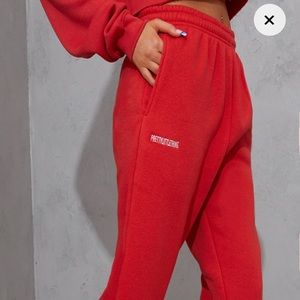 RED SWEATPANTS NEW WITH TAG/ ORDERED 2 BY ACCIDENT
